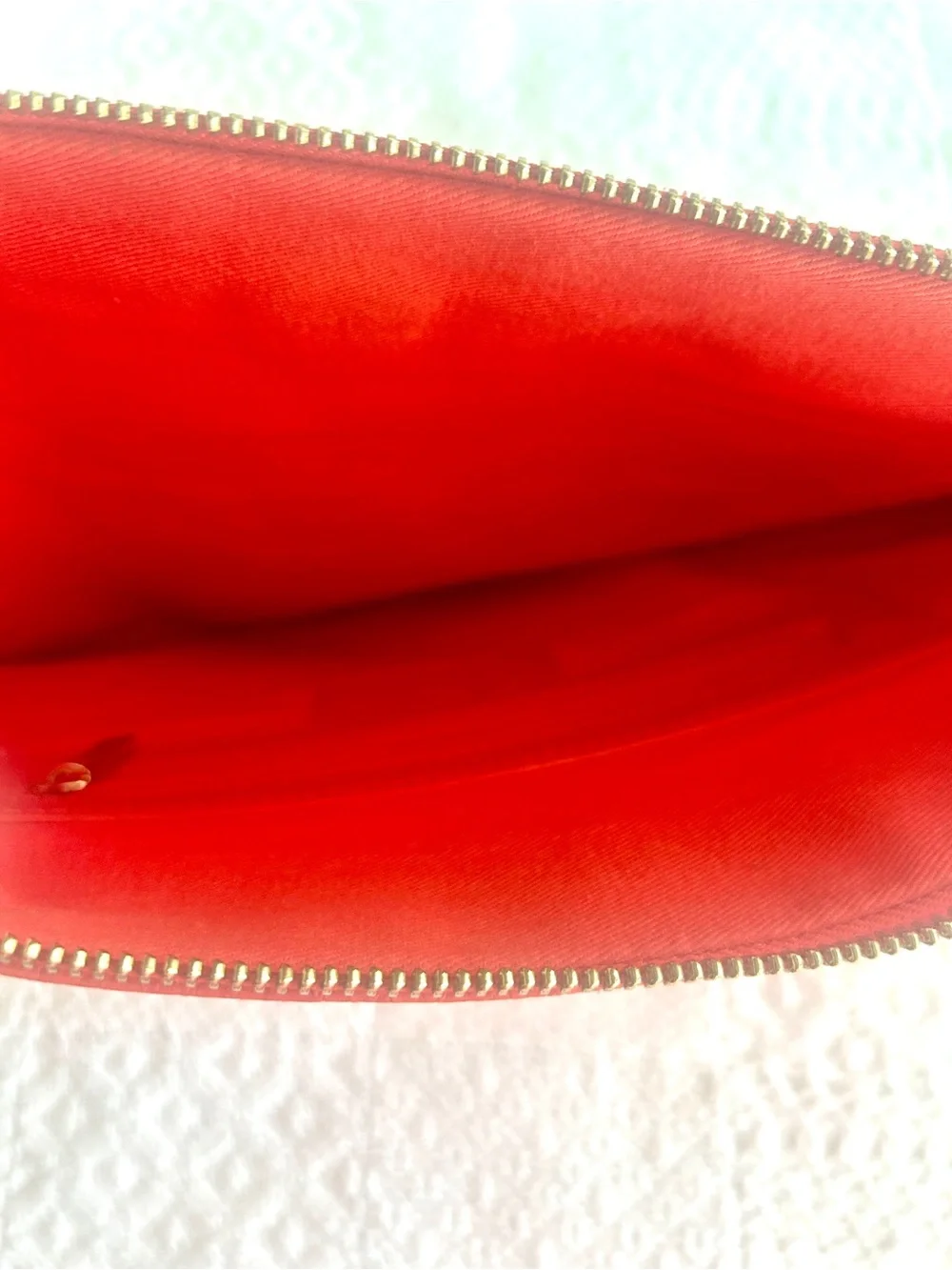 C. Wonder Clutch Orange Red Embossed Print Zip Close with Gold C Emblem
